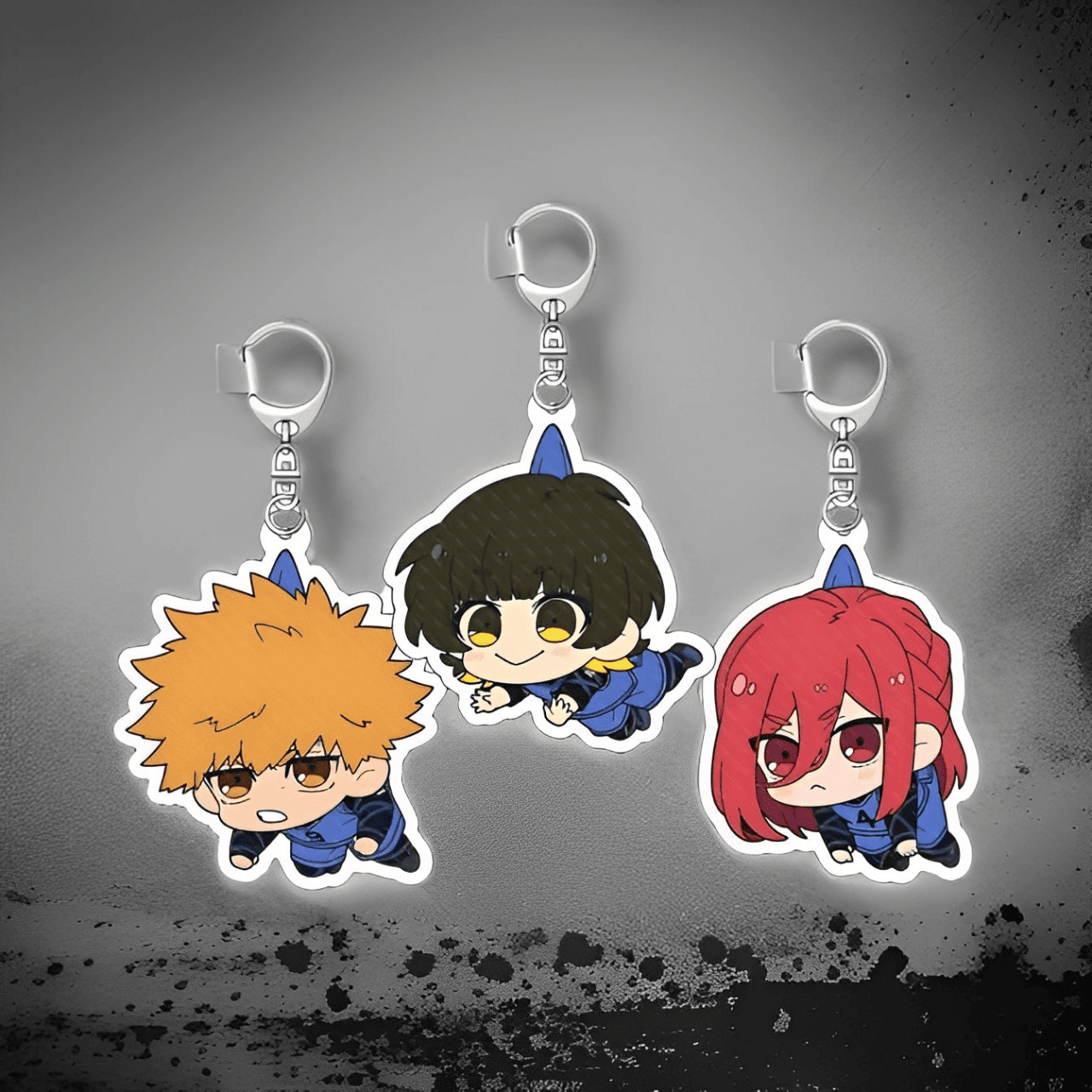 Porte-clé BlueLock illustrant Rensuke Kunigami, Meguru Bachira et Hyoma Chigiri